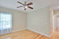 View of 3rd bedroom. As you exit, the door to left leads to the room's single vanity and walk in closet.