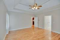 The door to the right leads to the primary bath and 2 walk in closets.