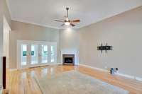 This view of the living room includes the French doors that lead to the sunroom.