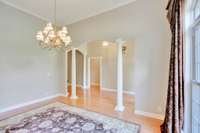 This view of the dining area with the larger left doorway leading to the living room and the smaller door on the right leading to the guest rooms.