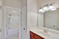 The 2nd bedroom's vanity with sink and closet.