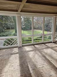 Whether dining with the family or hosting a party, this screened porch works almost year round.