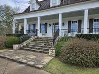 Front stairs lead to large front  porch