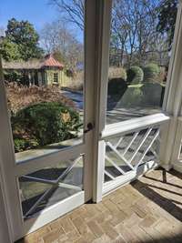 View from screened porch to pool house