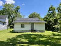 Rear of home. Level backyard