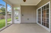 Screened patio with breezy ceiling fan.