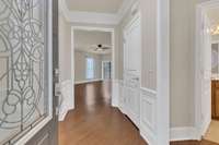 Entrance with wainscoting trim, crown molding and 7 1/4 in baseboards.  Move-in Ready!