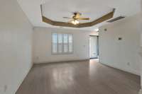 Light colors, open space and natural light make this living area an inviting space!