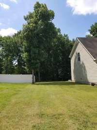 Beautiful side yard provides just the right amount of privacy between neighbors, while still enjoying the comforts and conveniences of living in CreeksBend!