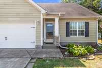 Precious landscaping and a covered front porch offer you a warm welcome every time you come home!