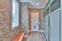 Entry from garage w/lockers & new wall paper.