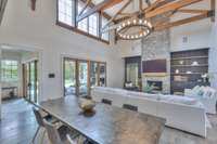 Soaring ceilings w/wood beams & stone fireplace.