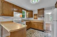 Cozy kitchen with vintage charm and plenty of storage.
