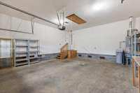 Additional view of the garage with entry to the attic for extra storage