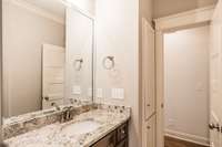 Bathroom on main floor, shared by bedroom 2 and 3. Granite countertop.