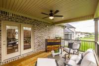 Enter the back covered deck from the main floor.