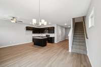 Open Concept Kitchen/Great Room Area that Also Promotes a Formal Dining Space.