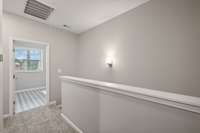 Oversized Utility/Laundry Room - Located Just at the top of the stairs, Centrally Located to all 3 Bedrooms.