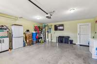 Two car garage, with storm door.