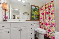 Full bath on the first floor.  Combination shower/tub.  Updated toilet.
