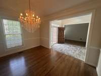 Formal dining room and an office on the other side of the grand entry foyer. The tile work and the hardwoods look fantastic!