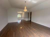 This is an enormous upstairs bonus area that is flexible. There are so many uses for this space. All three upstairs bedrooms are carpeted.