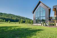 50 ft glass windows allow for expansive views of both the river and the mountains.