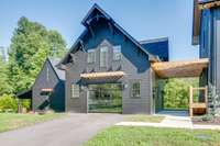 The carriage house has a beautiful, custom spiral staircase and a covered deck with unobstructed views of the river.