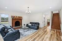 A cozy wood-burning fireplace welcomes you into the home