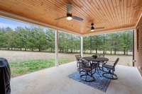 Large back porch w/ tongue and groove ceiling. The perfect gathering spot or quiet retreat.