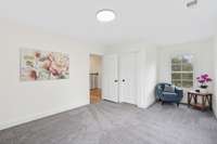 Bedroom 2 w/ walk-in closet and views of front acreage