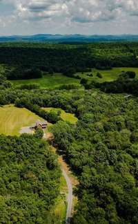 Aerial drone footage of acreage from the road