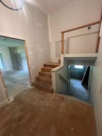 Landing leads to garage, bonus room, and attic