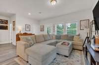 Light filled living area, opens to the backyard