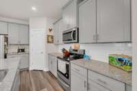 Ample countertop space for baking and plenty of cabinets!