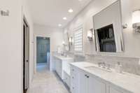 Primary bath with Carrera marble. The bath floor is heated.