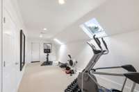 Exercise room with two skylights that have built in shades....