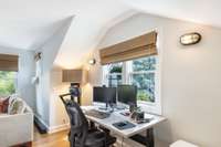 Currently is a home office and tv room with surround sound. There are three ways to get to this room. From the exercise room, up the outside stairs to its separate entrance on the back, or with the lift (elevator).