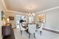 Large dining room (18x15) that accommodates a 60" round table. A large Farmhouse table will easily fit as well.