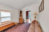 This room was likely at one time a side porch.  It is off the foyer and dining room.