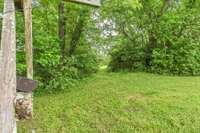 This gorgeous lot has a secret grove through the opening.
