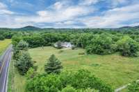 Land goes to the white fence on the right side ( bottom right of photo) showing the over 500' of frontage.  Room for horses, barn, another home....so much potential.