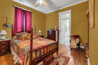 This 15x13 bedroom is to the right off the foyer and is a suite with a flexible second room both having access into the oversized bathroom.