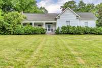 Location, Location!  Circa 1900 Southern Colonial with pillared porch on 5 gorgeous acres located within walking distance of Southall Inn & Resort, & only 4.5 miles. to both downtown Franklin & Leipers Fork.