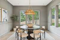 Large dining space with custom designer lighting and lots of natural light
