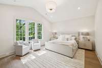 Oversized Primary suite with soaring vaulted ceilings, huge windows for natural light