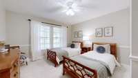 This lovely downstairs guest room looks out over the front yard.  Your guest may not want to leave.