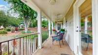 The back porch also provides a nice breezy spot with lighted ceiling fans.  What a great spot to sit and look out over your beautiful backyard.