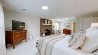 The doors to the right and left are closet spaces.  The open doorway leads into the owner's full bathroom.