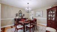 This very spacious dining room is to the left of the entry and just off the kitchen. Need a larger table, not a problem.